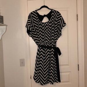 Chevron print dress with cut-out back and belt.